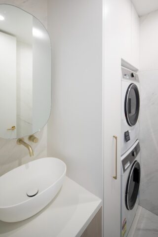 Harbourside apartment renovation laundry with wash basin